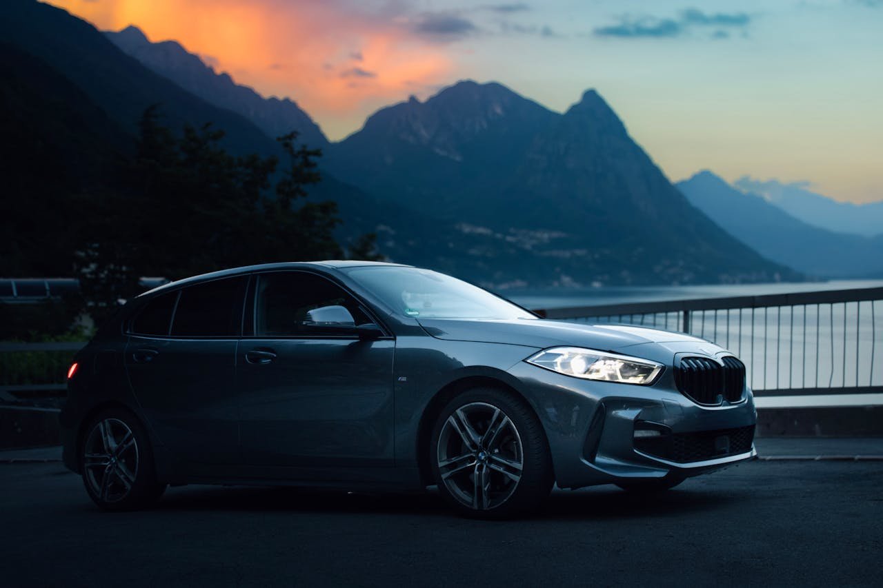 luxury-car-at-scenic-lake-como-sunset-33477755